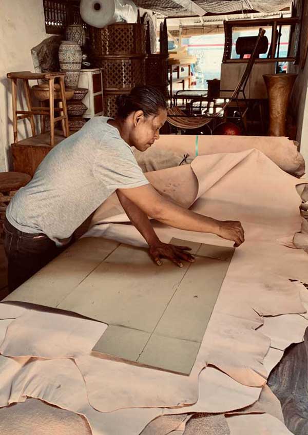 worker cutting leather 